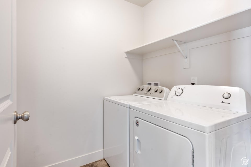 Laundry room featuring washing machine and clothes dryer