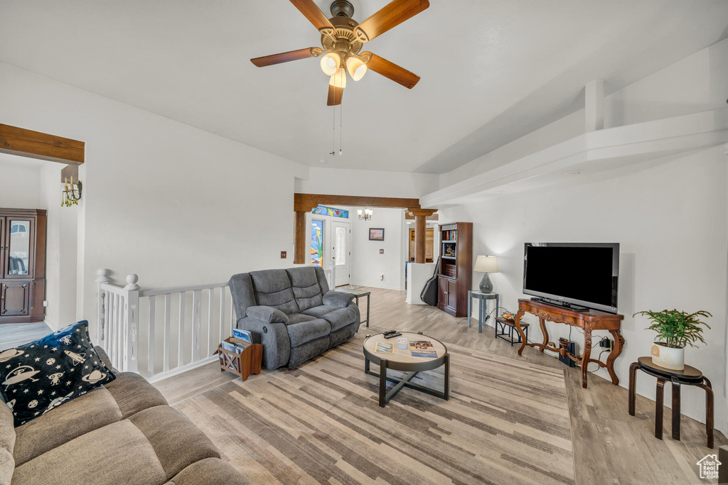 Living room featuring ceiling fan and light wood-type flooring