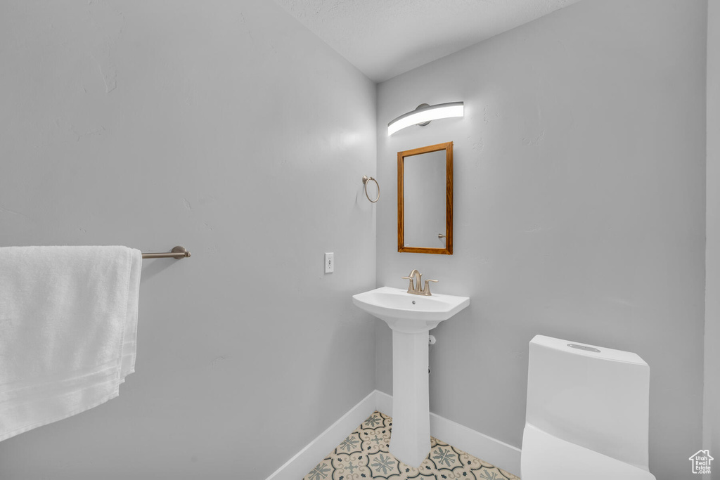 Bathroom featuring sink and tile floors