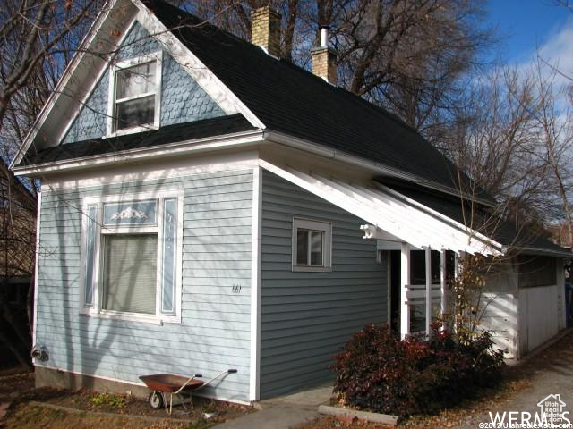 View of property exterior with a garage