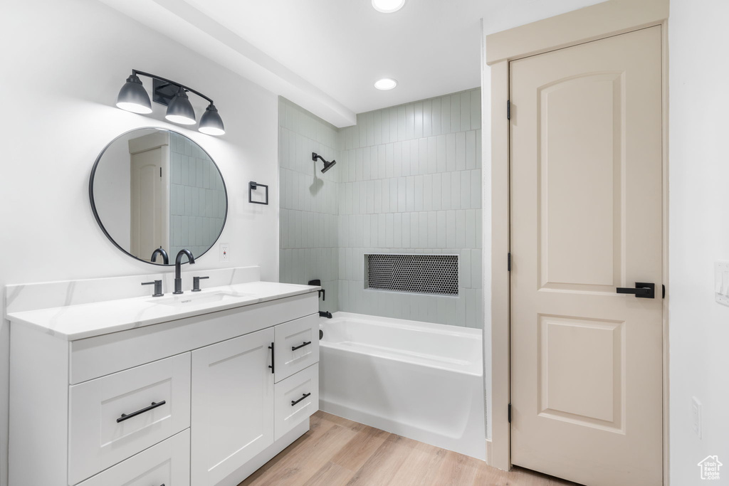 Bathroom with vanity and hardwood / wood-style floors