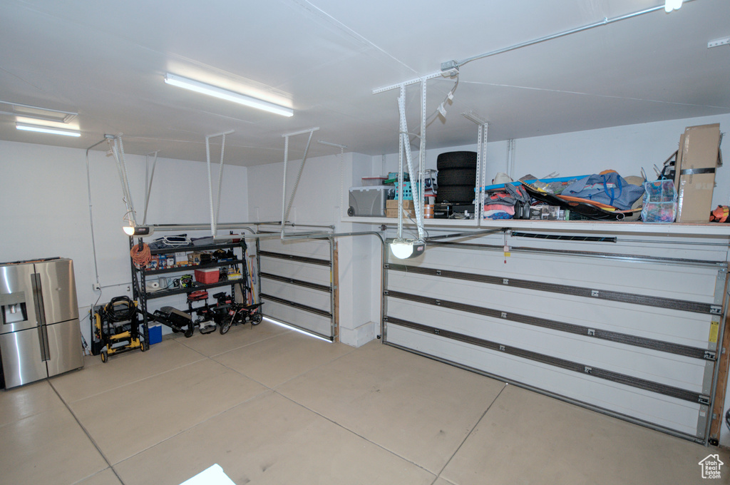 Garage with stainless steel fridge