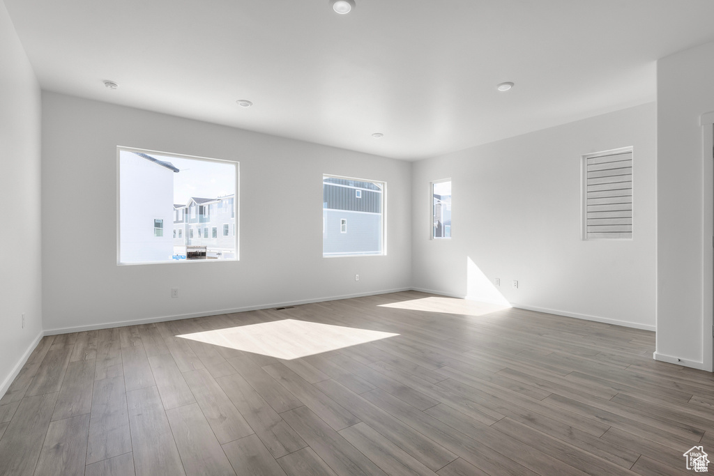 Unfurnished room with dark hardwood / wood-style floors