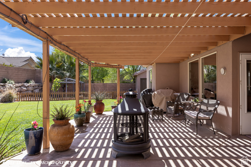 View of patio with a pergola