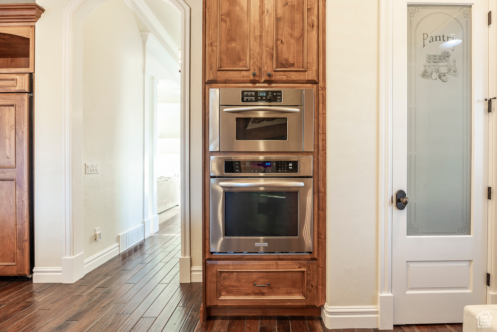 Kitchen featuring dark hardwood / wood-style floors and double oven