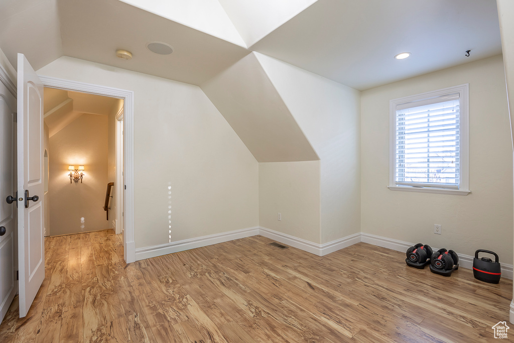 Bonus room featuring vaulted ceiling and light hardwood / wood-style floors
