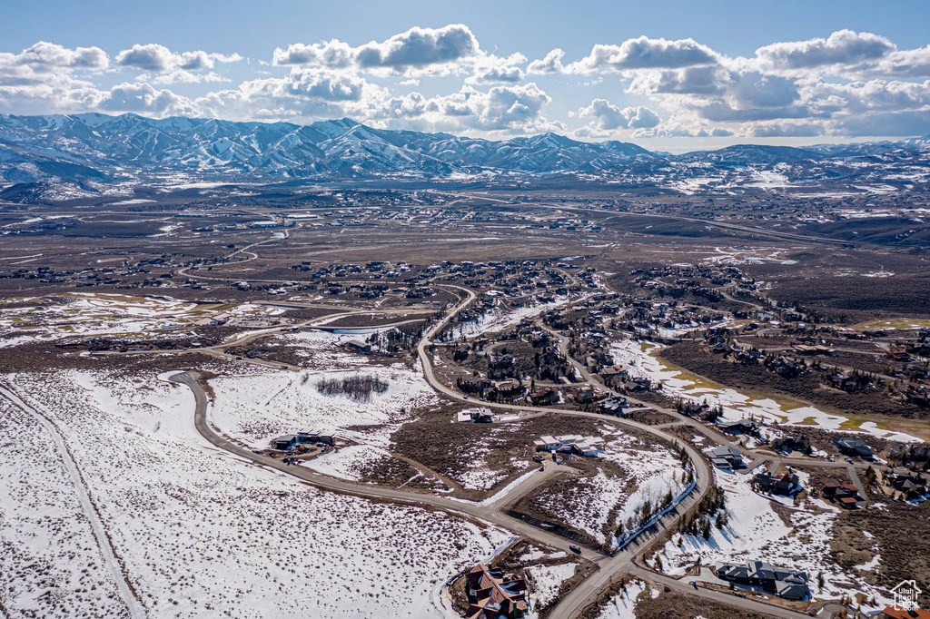Snowy aerial view featuring a mountain view