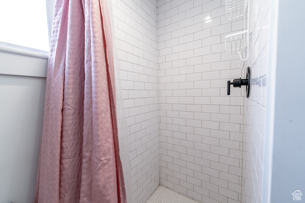 Bathroom featuring a shower with curtain