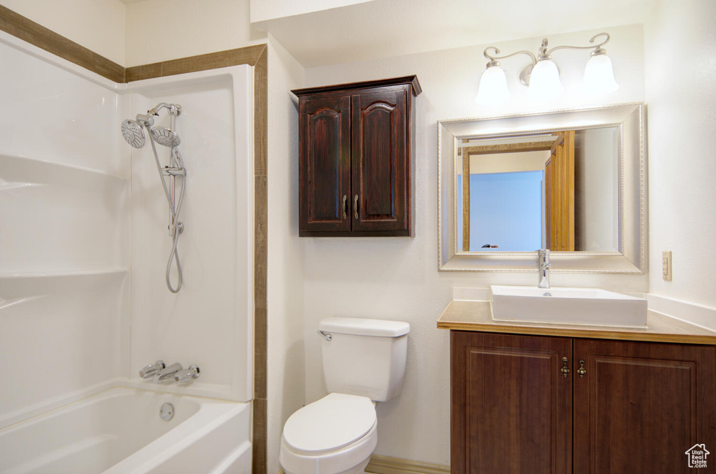 Full bathroom featuring  shower combination, toilet, and vanity