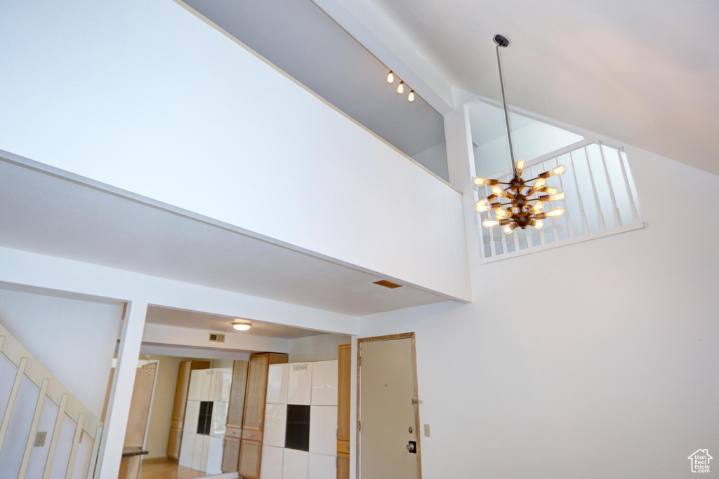 Interior details featuring track lighting and a notable chandelier