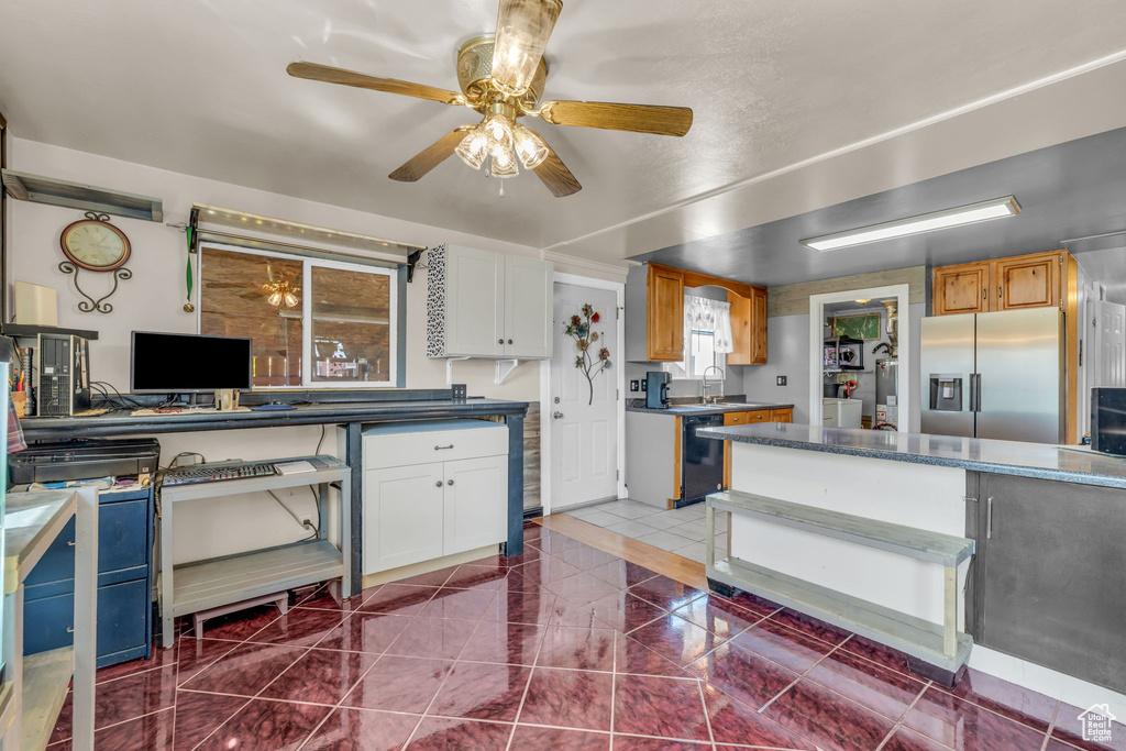 Kitchen featuring ceiling fan, dark tile floors, white cabinets, and stainless steel refrigerator with ice dispenser