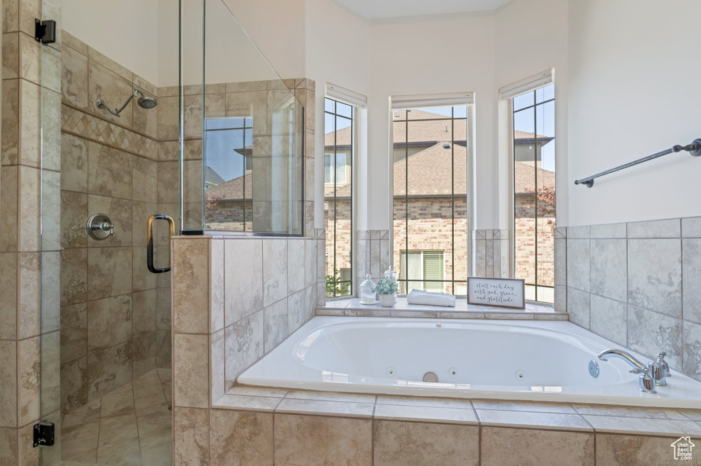 Bathroom with a wealth of natural light and independent shower and bath