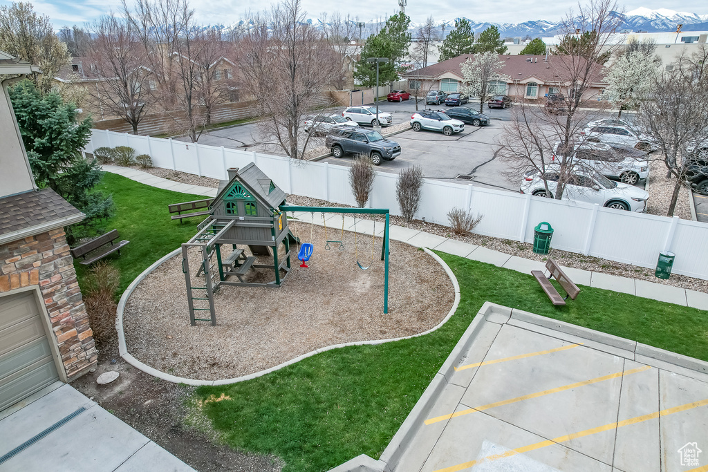 Exterior space featuring a playground and a mountain view