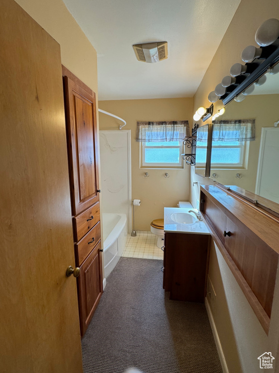 Full bathroom featuring oversized vanity, toilet, shower / bathing tub combination, and tile flooring