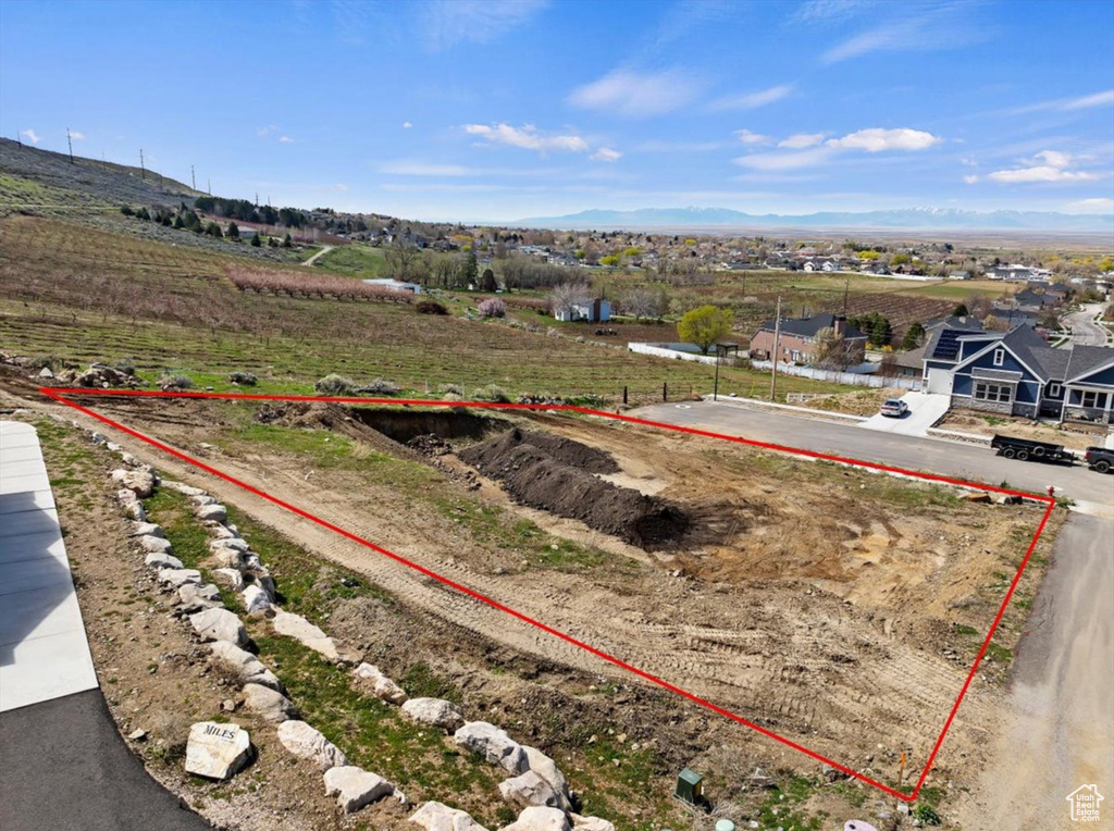 Birds eye view of property with a rural view and a mountain view