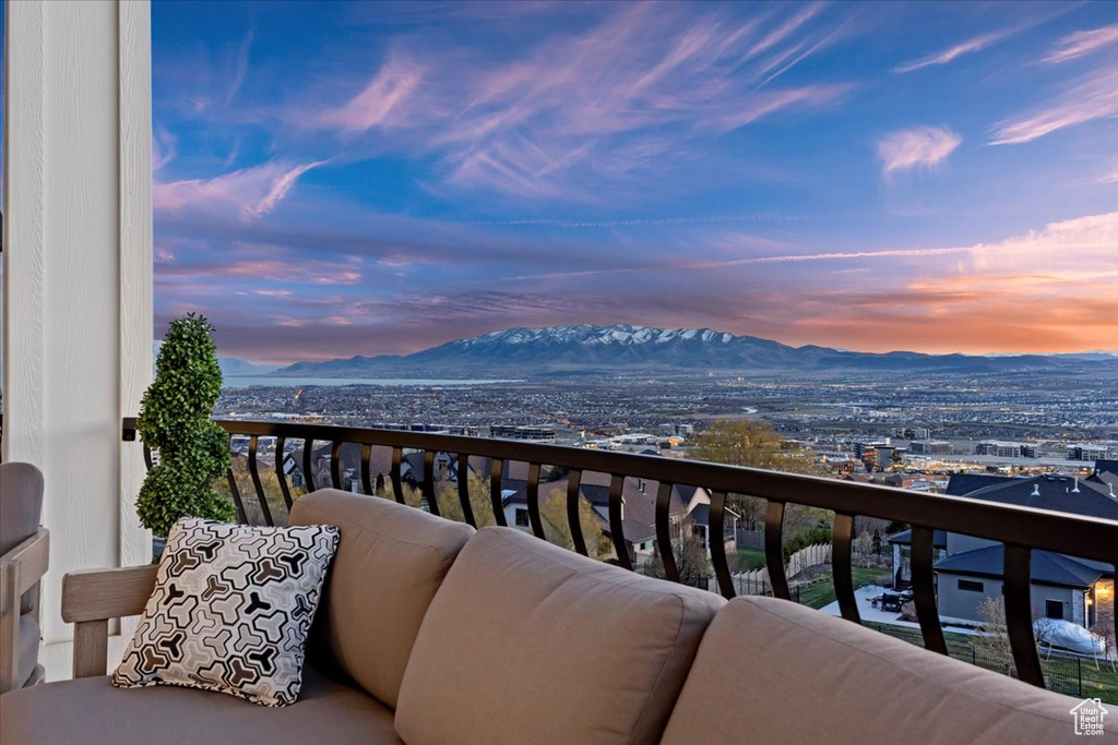 Balcony at dusk with a mountain view
