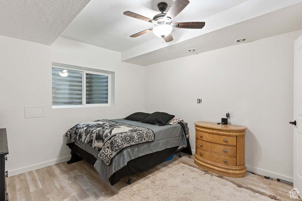 Bedroom featuring ceiling fan and light hardwood / wood-style floors