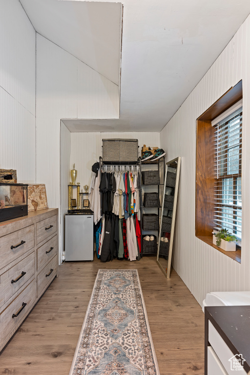 Spacious closet featuring light hardwood / wood-style floors
