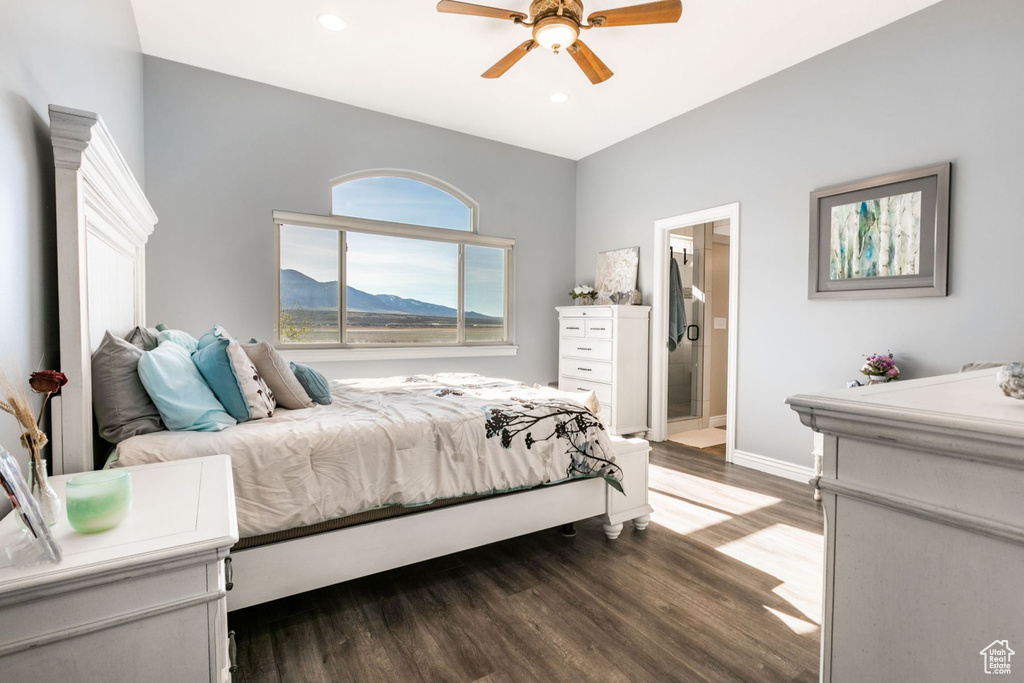 Bedroom featuring ceiling fan, a mountain view, dark wood-type flooring, and ensuite bathroom