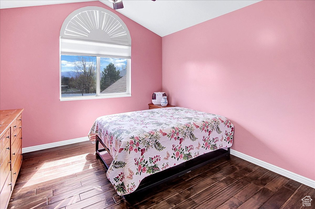 Bedroom featuring lofted ceiling, ceiling fan, and dark wood-type flooring