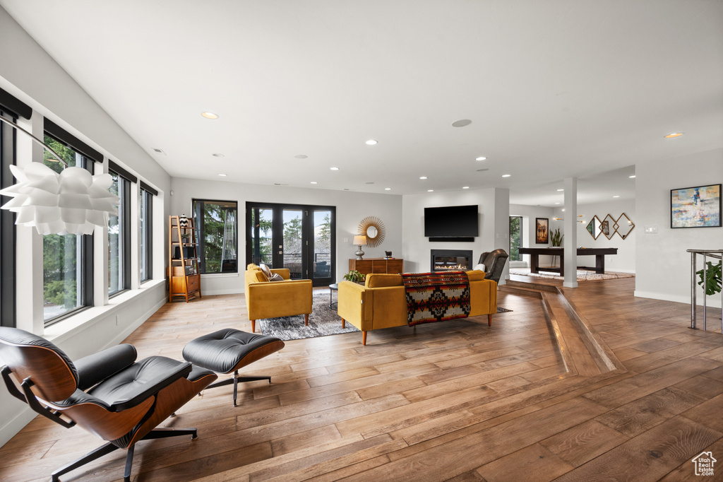 Living room featuring french doors and light hardwood / wood-style flooring
