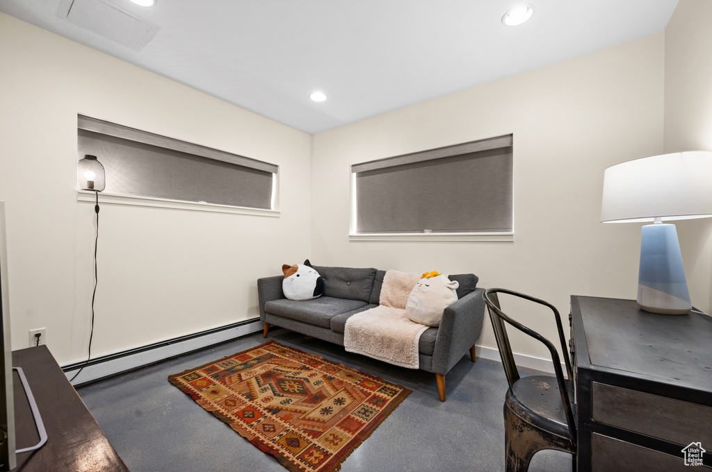 Living room with a baseboard heating unit