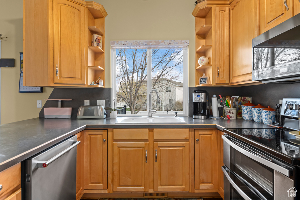 Kitchen featuring sink and stainless steel appliances
