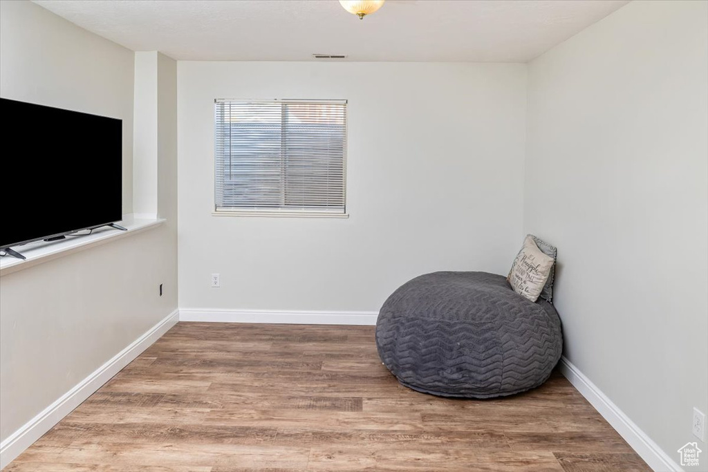 Living area with hardwood / wood-style flooring