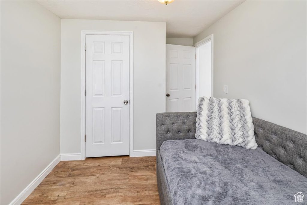 Living area with hardwood / wood-style floors