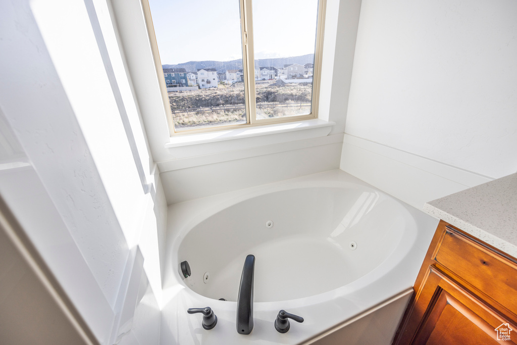 Bathroom featuring a mountain view and a bathing tub