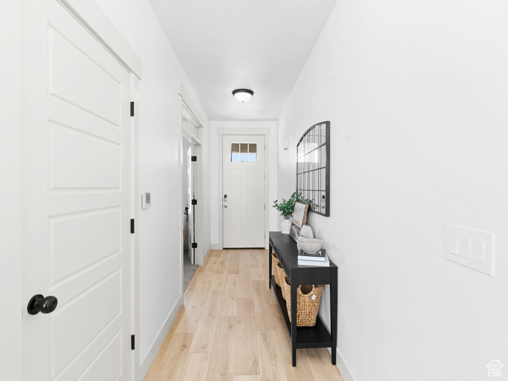 Hallway featuring light wood-type flooring