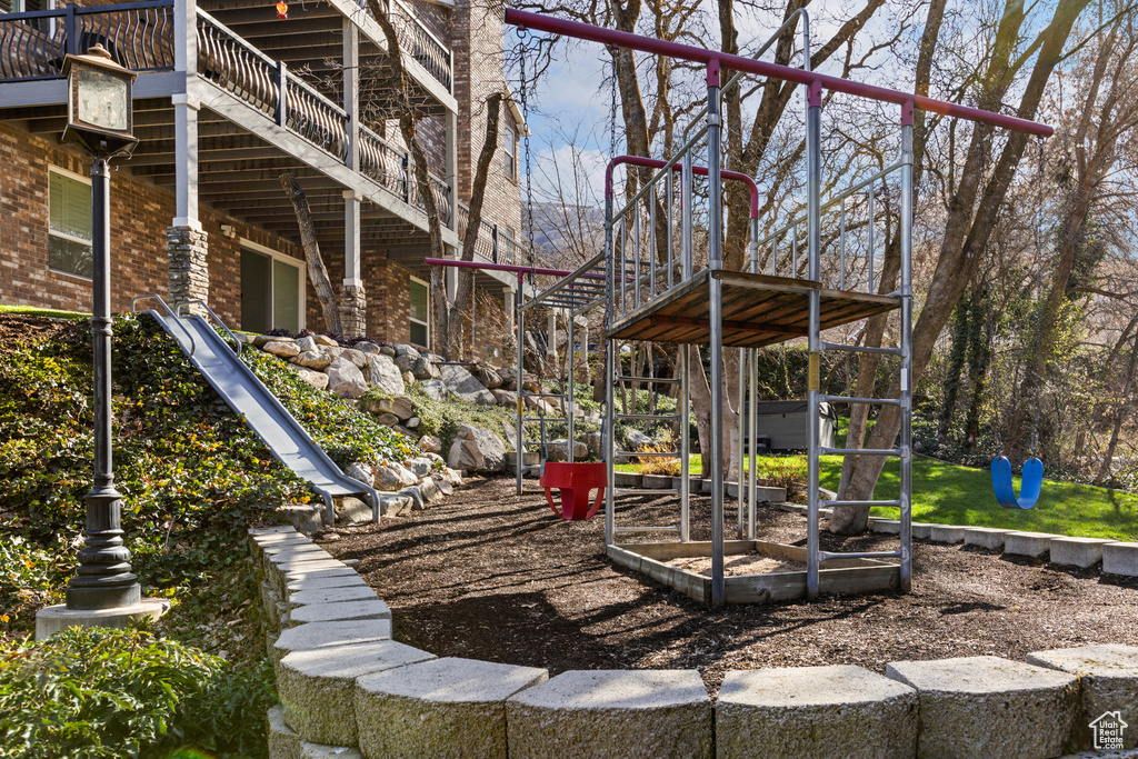 View of patio featuring a playground