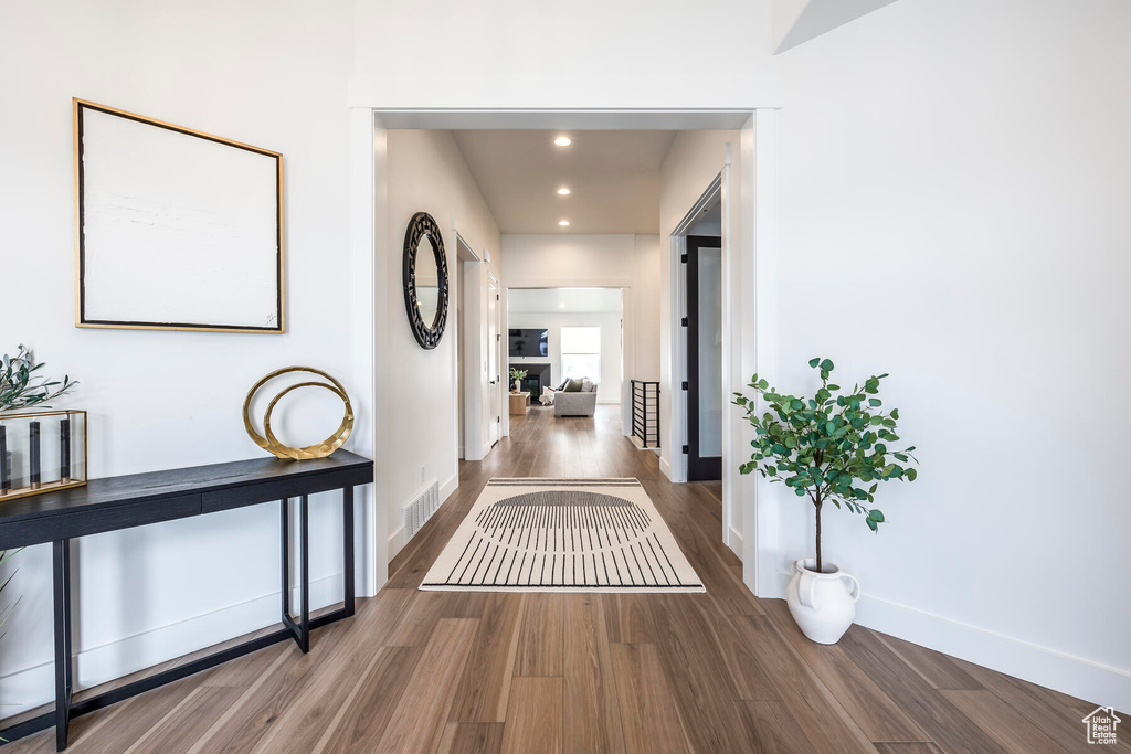 Hallway featuring dark hardwood / wood-style floors
