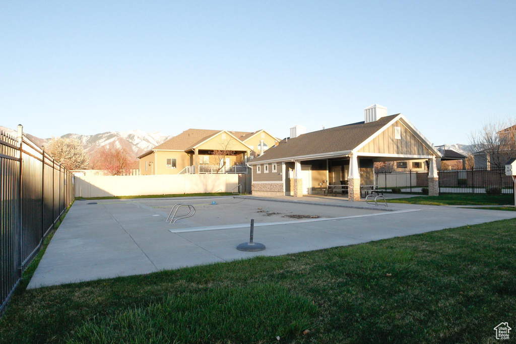 Exterior space featuring a yard and a mountain view