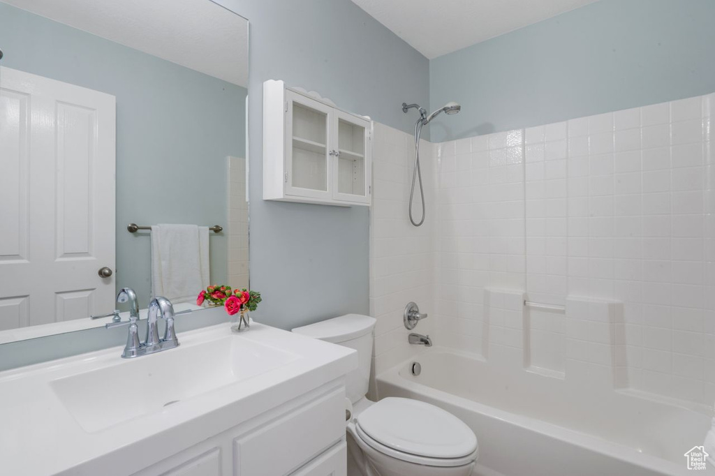 Full bathroom with shower / bathing tub combination, toilet, and vanity