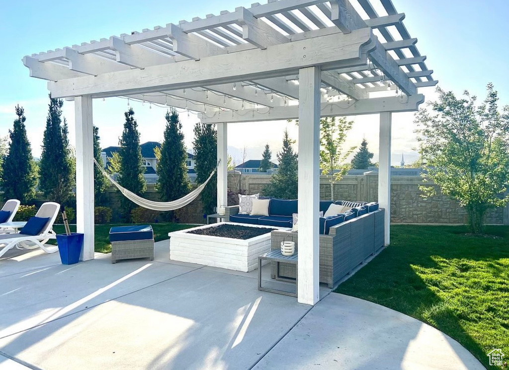 View of patio / terrace featuring a pergola and an outdoor living space with a fire pit