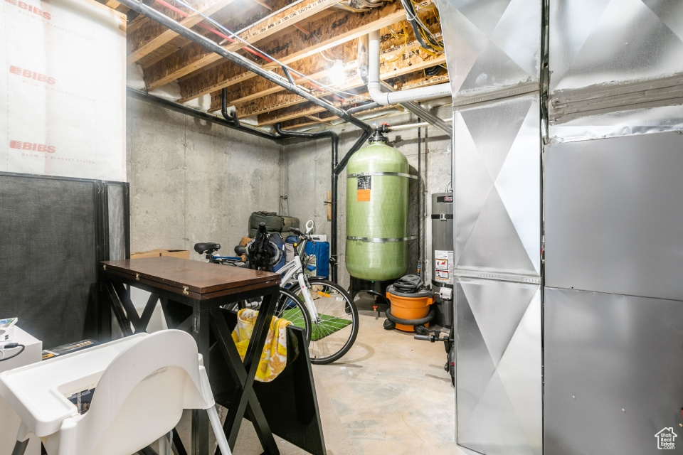 Basement featuring heating utilities and secured water heater