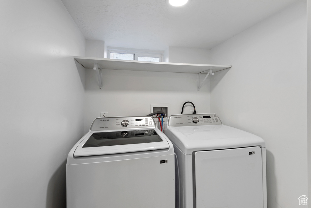 Laundry area with hookup for a washing machine and washing machine and dryer
