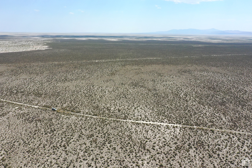 Aerial view featuring a rural view and a mountain view