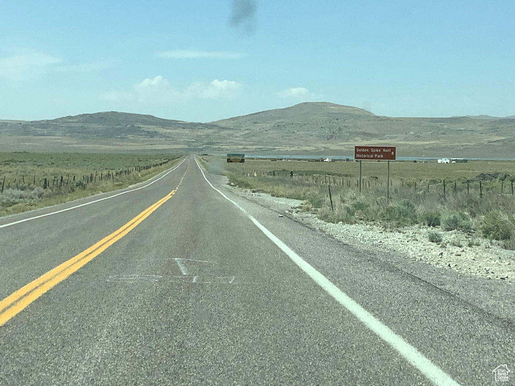 View of road featuring a rural view and a mountain view