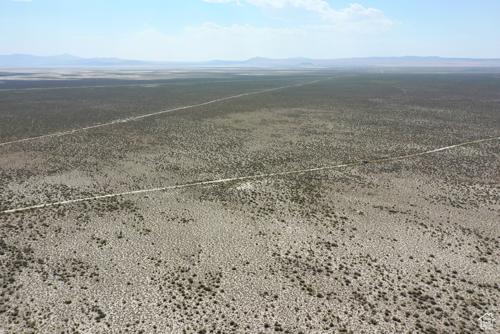 Birds eye view of property with a rural view and a mountain view