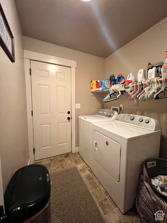 Laundry area featuring tile flooring, separate washer and dryer, and hookup for a washing machine