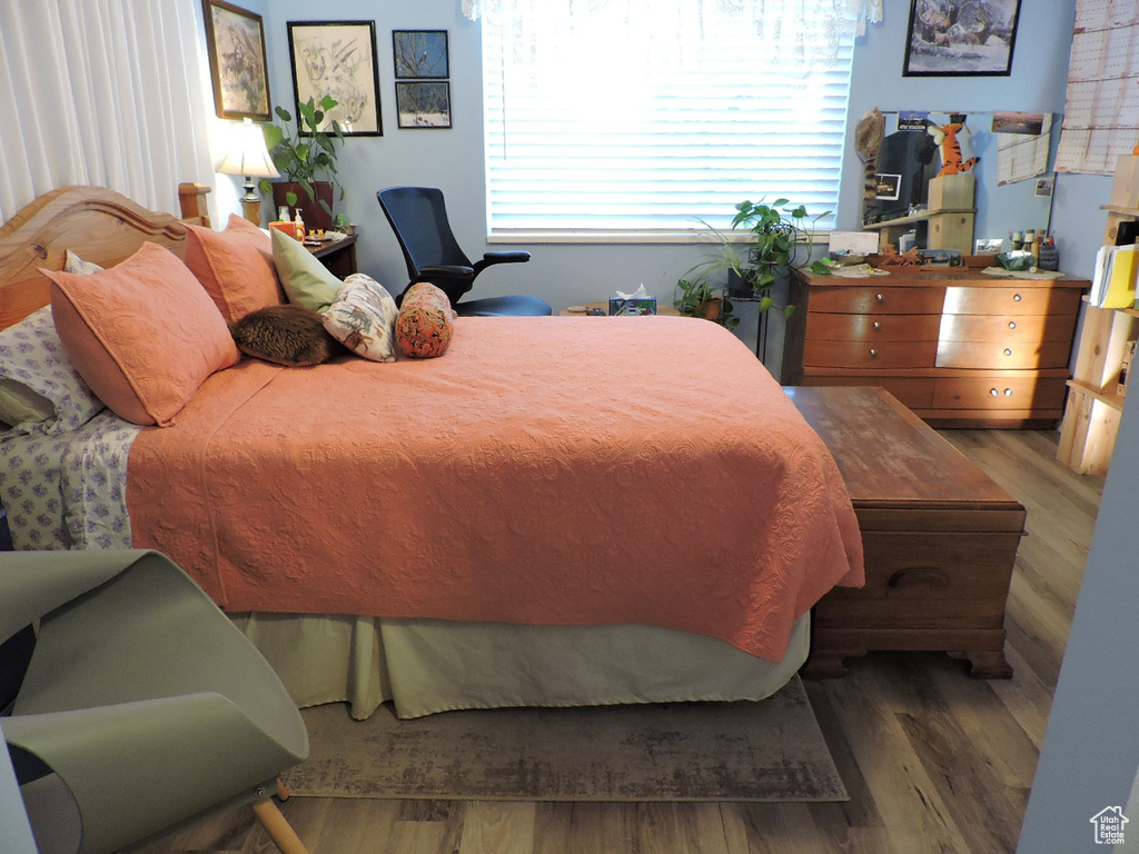 Bedroom featuring dark wood-type flooring