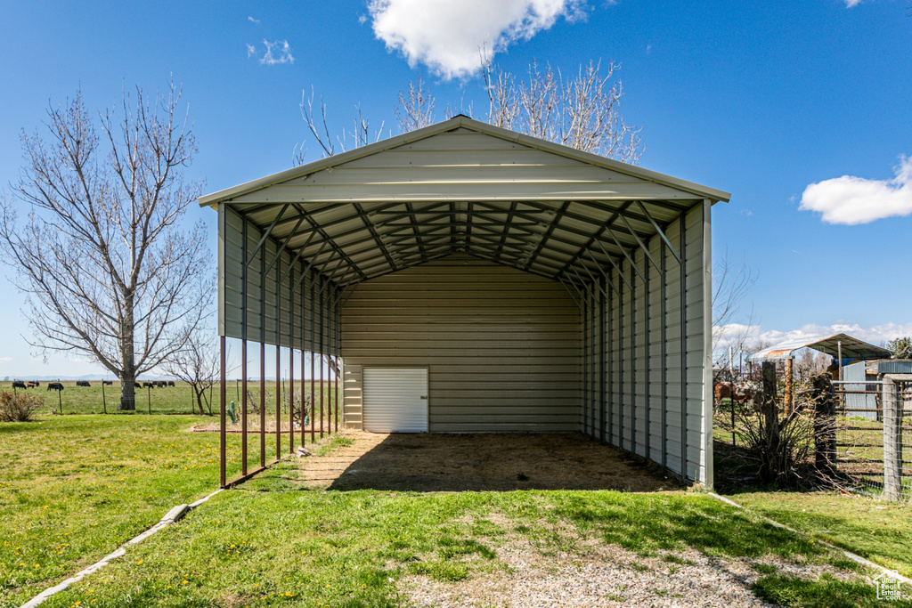 View of shed / structure with a yard and a carport