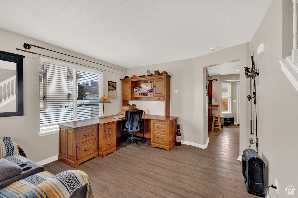 Home office featuring hardwood / wood-style floors