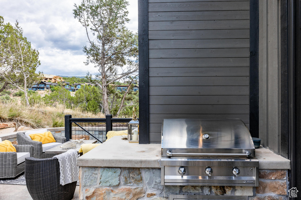 View of terrace featuring area for grilling and grilling area