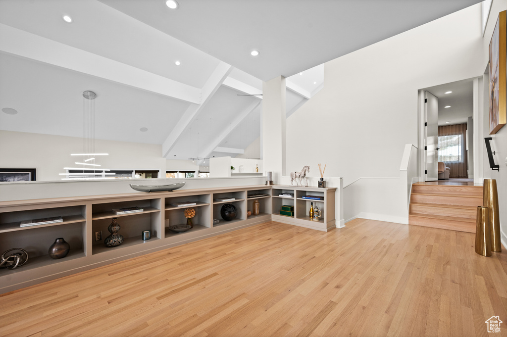 Interior space featuring light hardwood / wood-style floors and beam ceiling