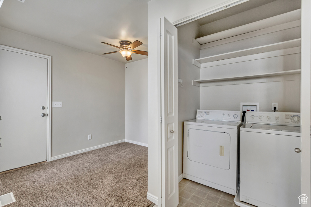 Washroom with ceiling fan, independent washer and dryer, washer hookup, and light tile floors