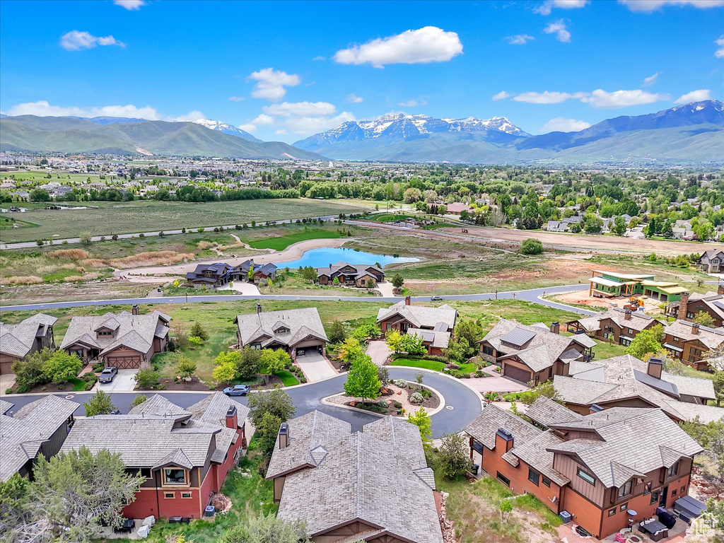 Aerial perspective of suburban area featuring a water and mountain view