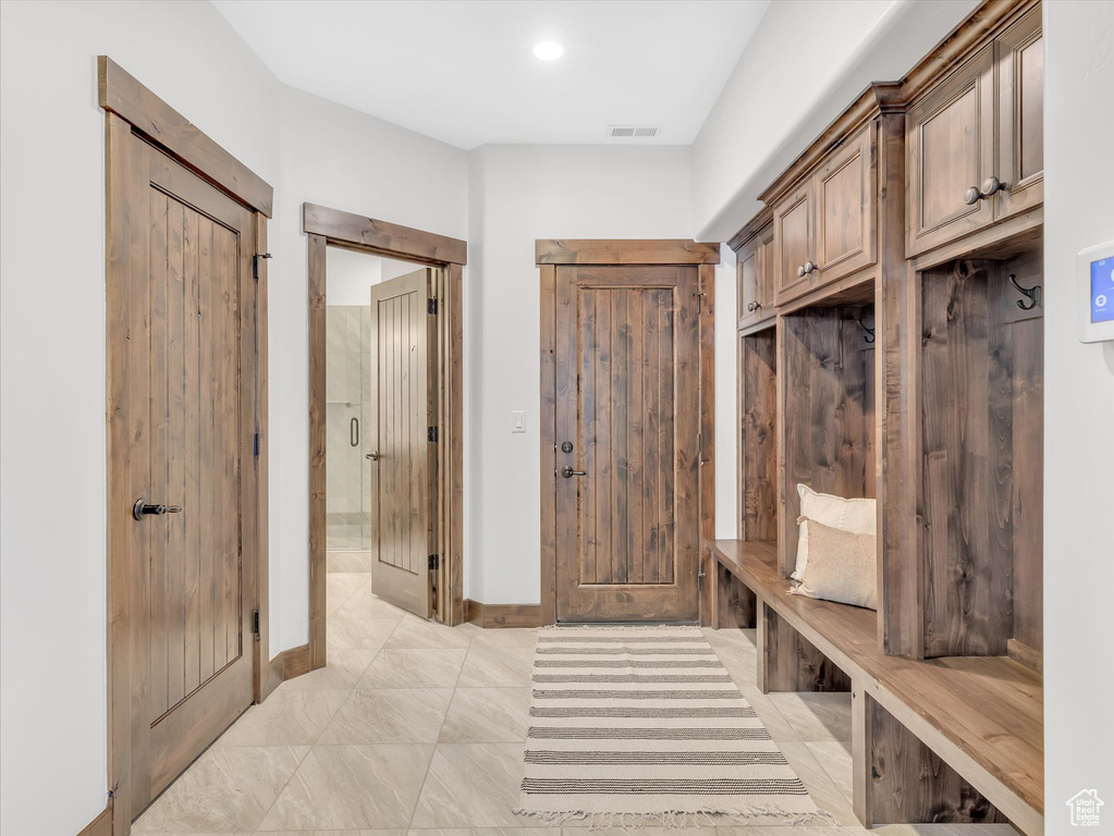 Mudroom featuring baseboards